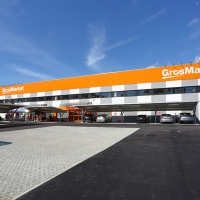 Take cura il cambio di marchio da Sogegross Cash & Carry a GrosMarket 